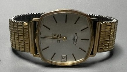 A gentleman's 1970's 9ct gold Rotary manual wind wrist watch, with case back inscription, on associated gold plated flexible link bracelet